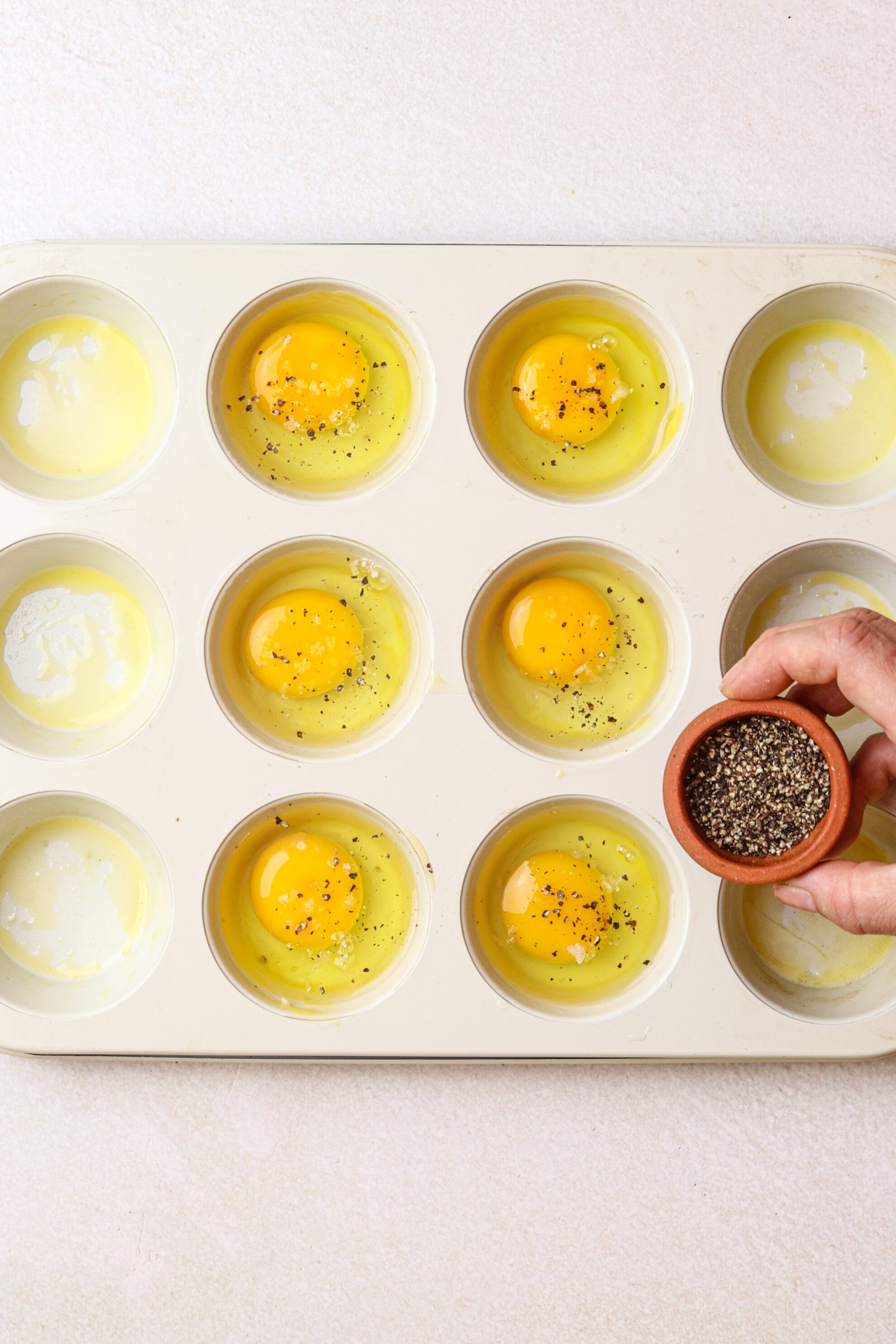 https://www.foodfaithfitness.com/wp-content/uploads/2023/12/Muffin-Tin-Eggs-Baked-in-Oven-Step-3.jpg