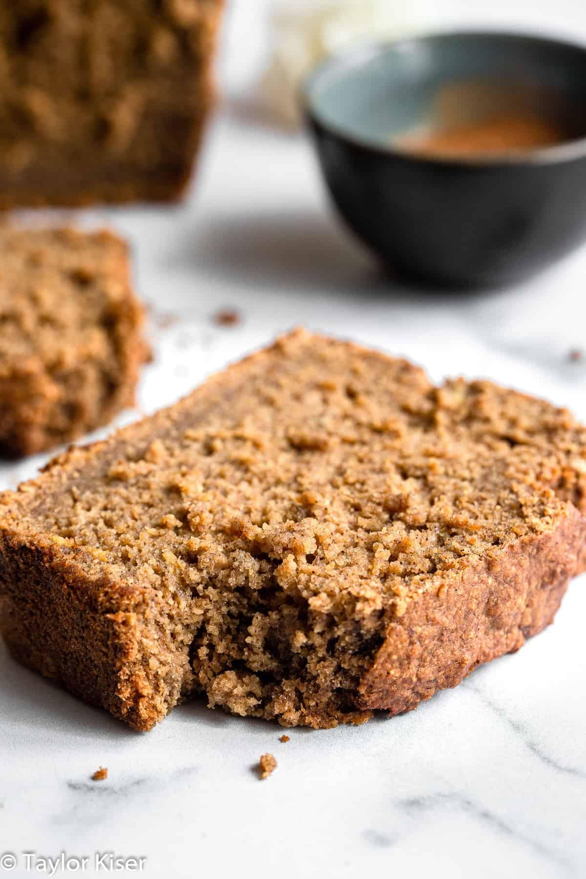 vegan gluten free banana bread with a bite out of a slice